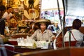 Thai woman working in a boat in the floating market nearby Bangkok